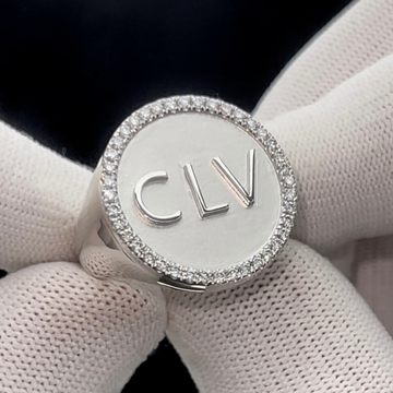 This is an extreme close up of a custom initial Signet ring with the initials being CLV. this ring is in platinum 