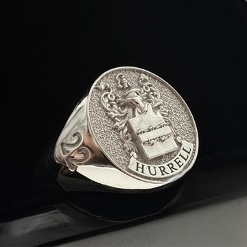 A close up shot of a Custom Family Crest Signet ring made from sterling silver