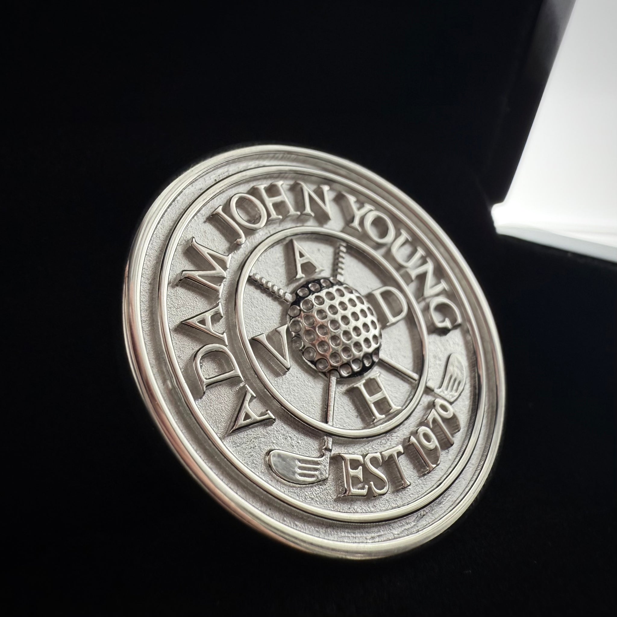 Close Up picture of a custom made sterling silver pendant on a black background