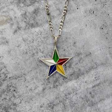 top angle close up shot of a custom druze star pendant in sterling silver with a figaro chain, on a grey textured background