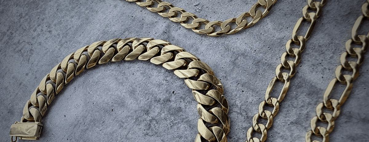Large banner of custom solid gold chains including cuban, curb, and figaro custom chains.
