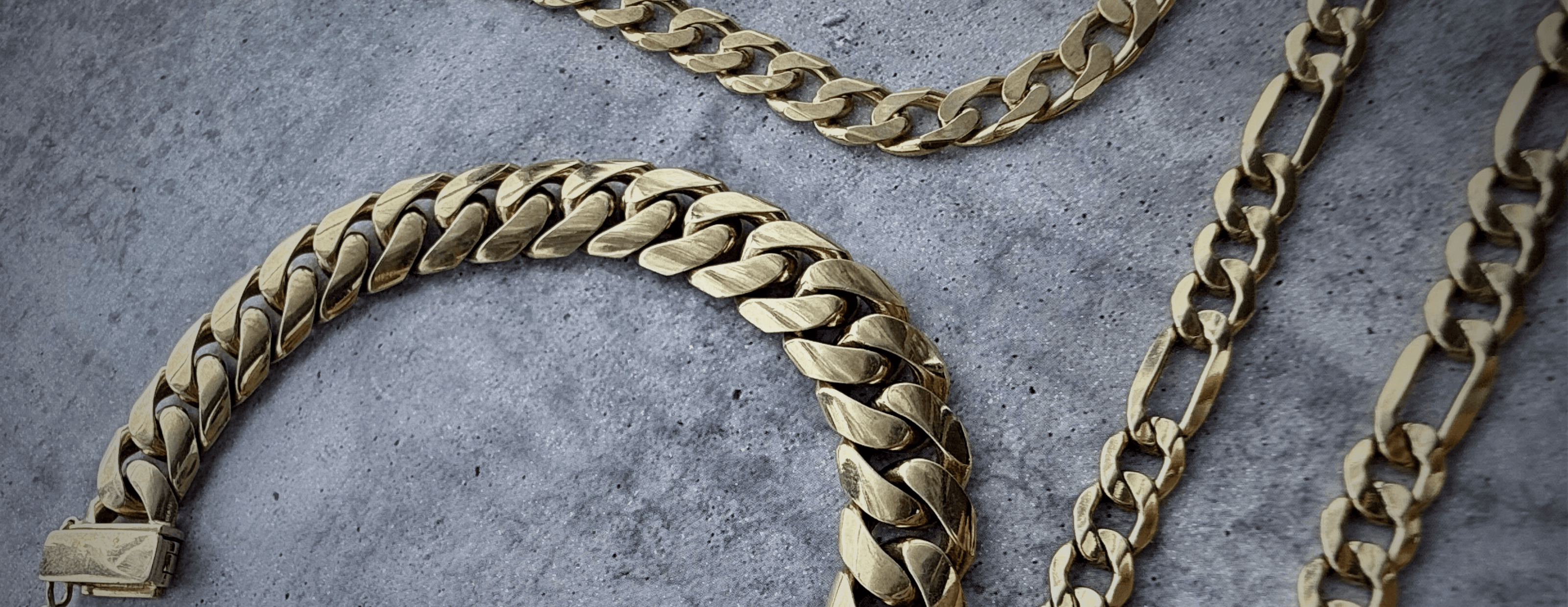 Large banner of custom solid gold chains including cuban, curb, and figaro custom chains.
